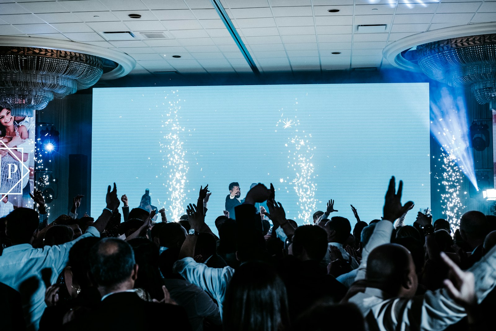 Crowd in front of a large LED screen